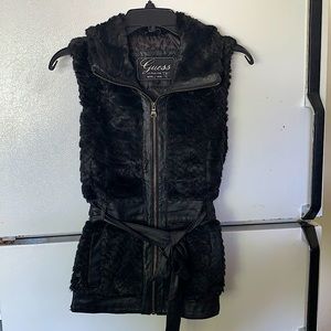 Faux fur and leather vest by Guess. Leather belt tie.